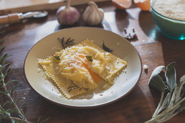 On-Demand : Big Ravioli Cacio and Pepe with Egg Yolk